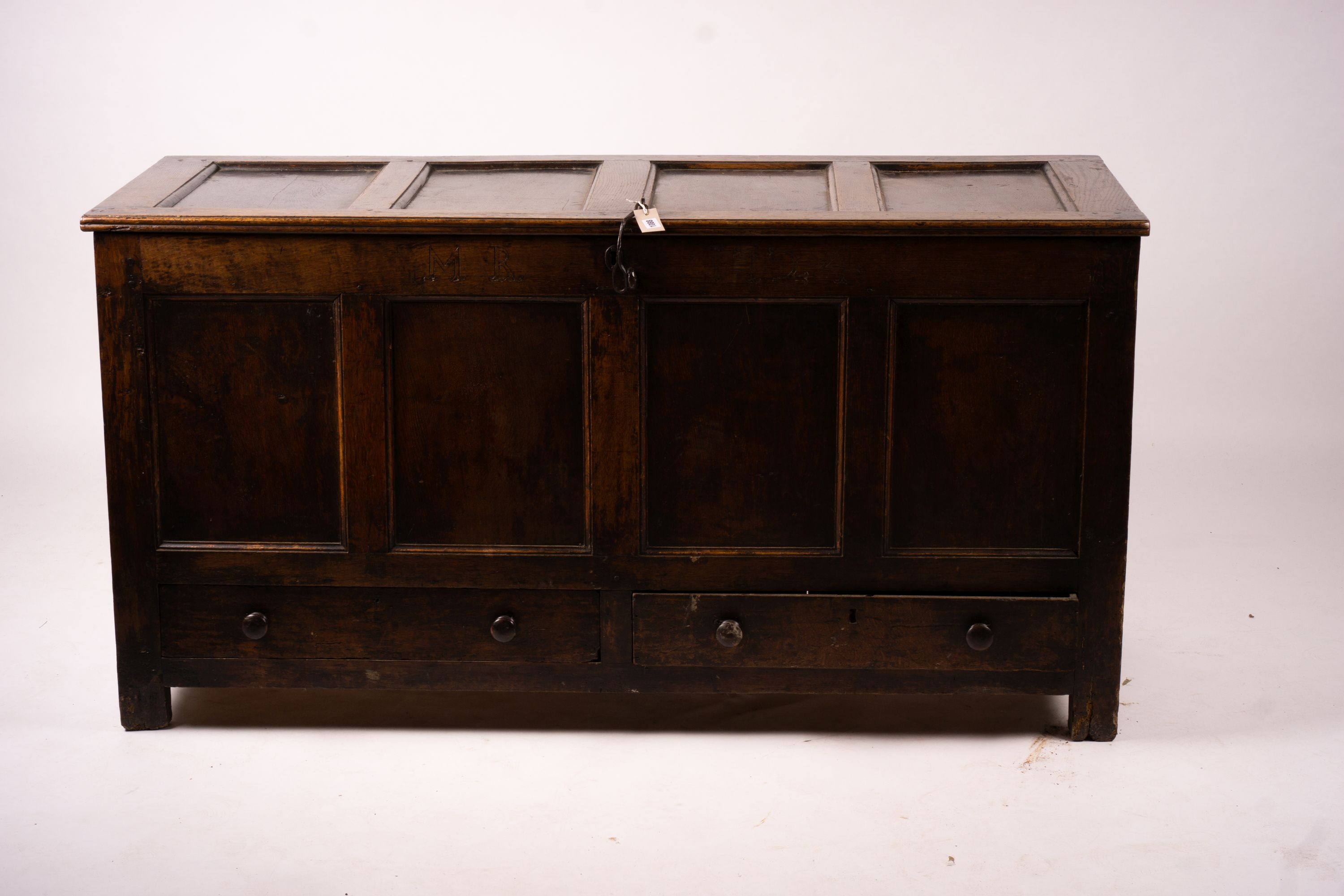 An 18th century panelled oak mule chest, length 161cm, depth 61cm, height 84cm